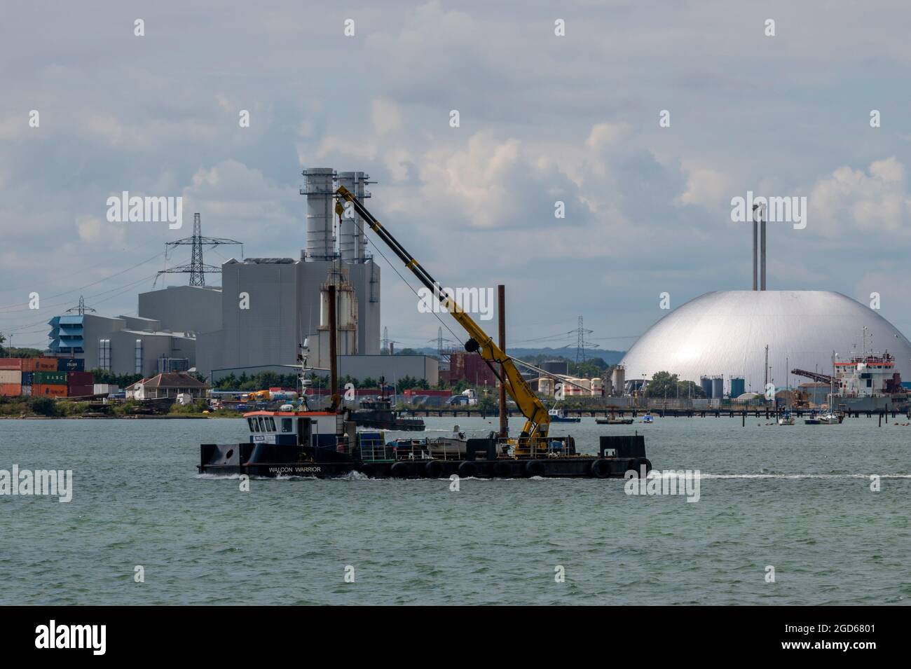 floating crane at work in southampton docks, marine services in port of southampton,barge with crane, marine barge carrying a crane, floating crane. Stock Photo