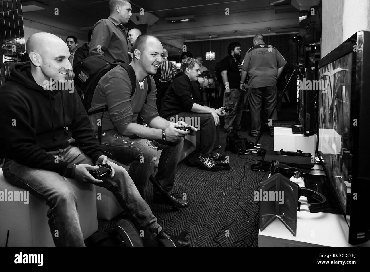JOHANNESBURG, SOUTH AFRICA - Jan 05, 2021: A grayscale of middle-age male gamers at Play Station PS4 launch event in Johannesburg, South Africa Stock Photo