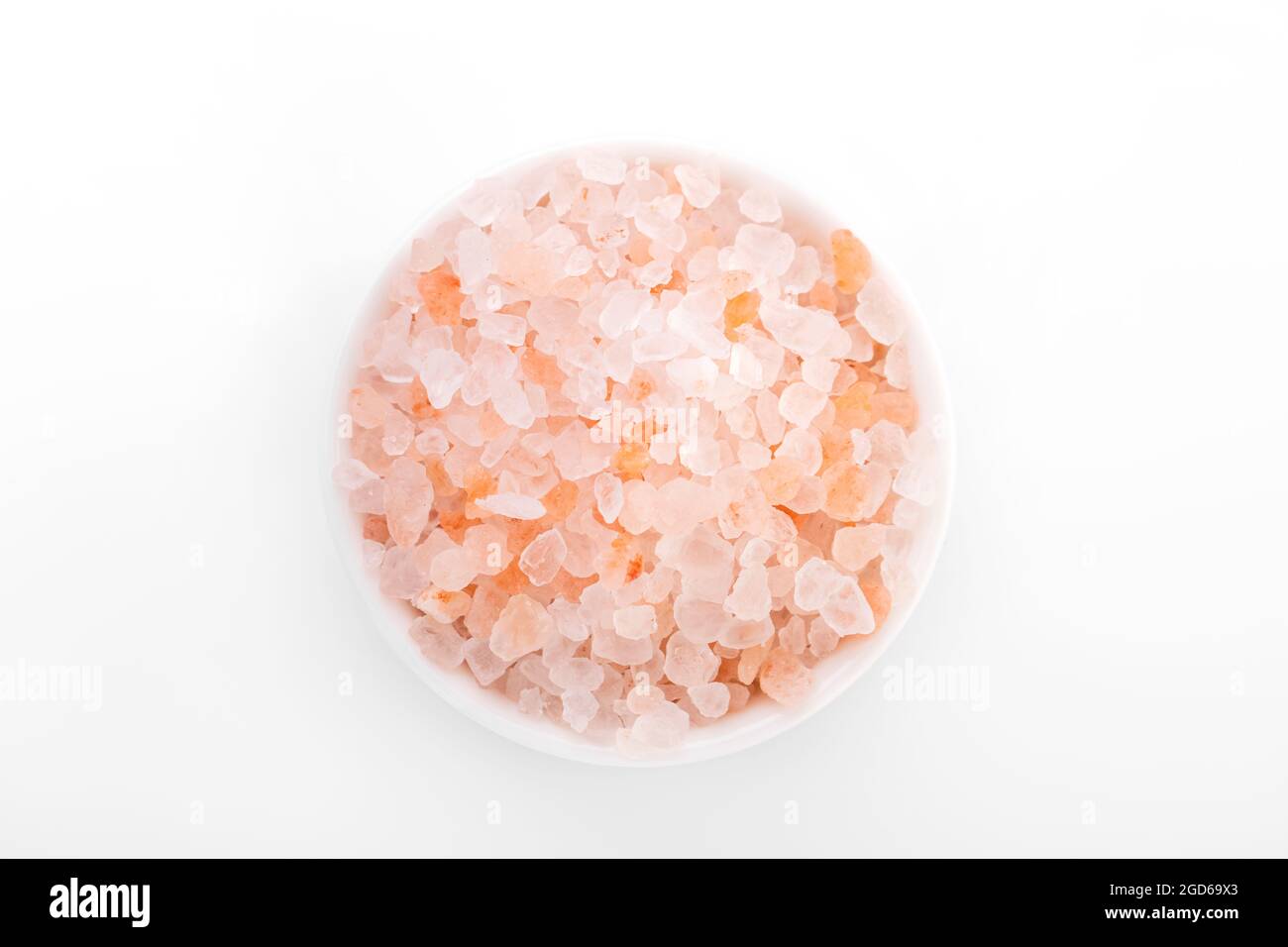 Himalayan salt, pink himalayan salt. himalayan salt in white bowl, on white background Stock Photo