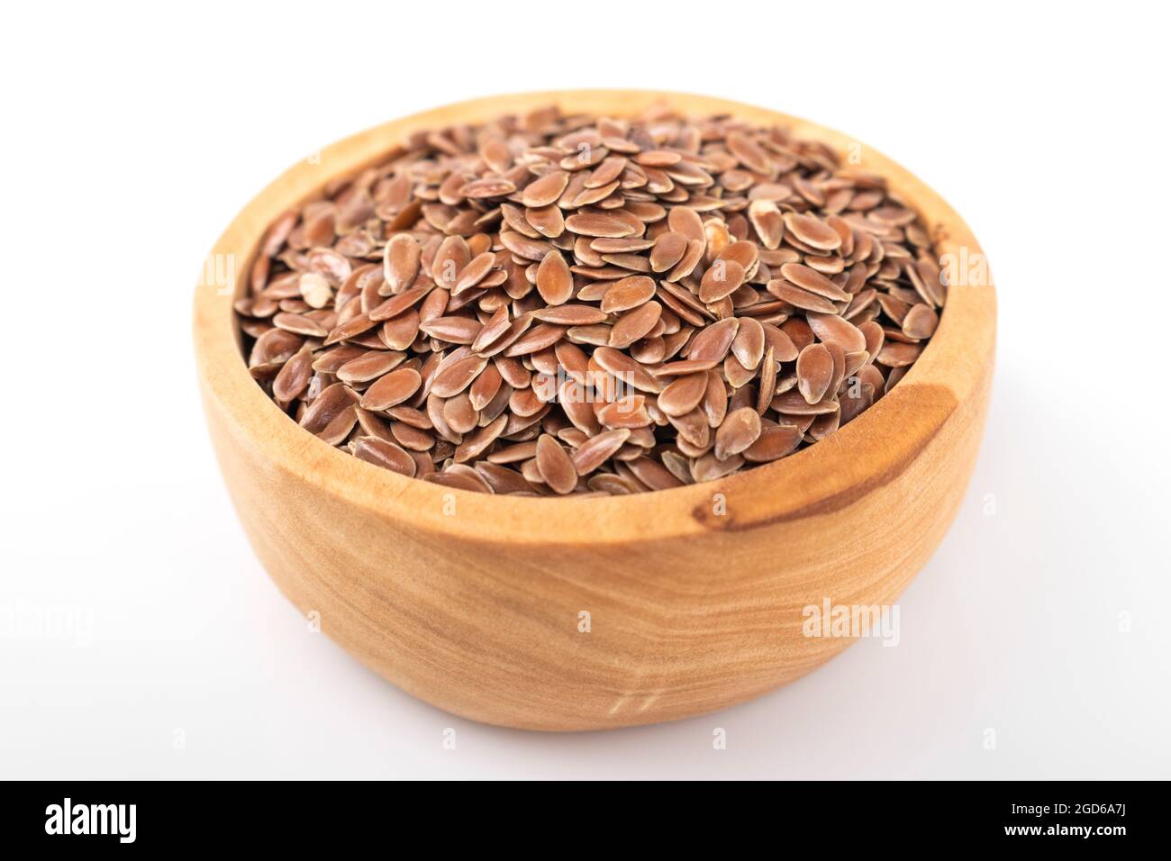 flax seed. flax seed in wooden bowl on white background. flax, seed. macro photo flax seed. Stock Photo
