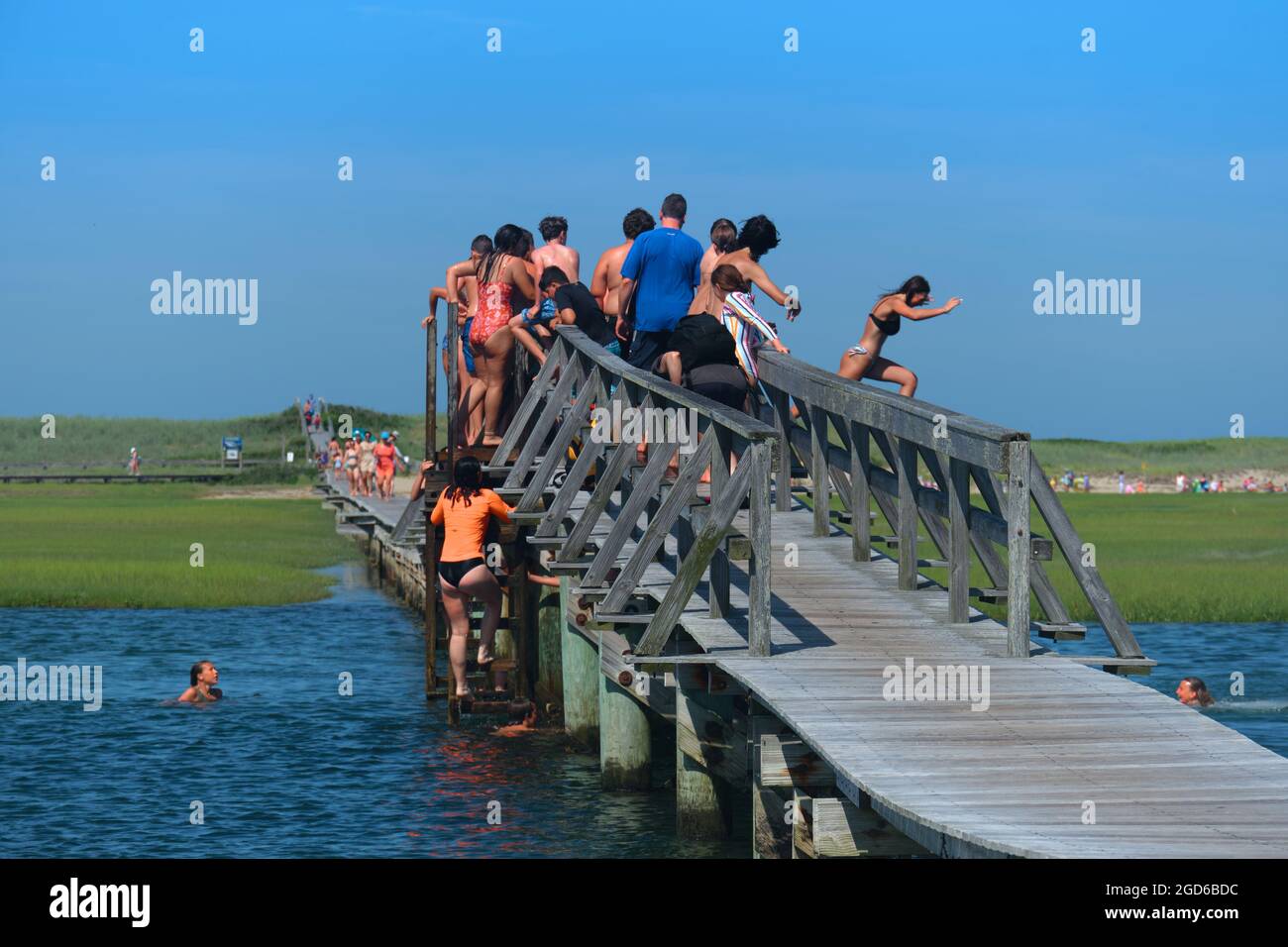 Children jumping of the bridge on Sandwich Boardwalk, Sandwich