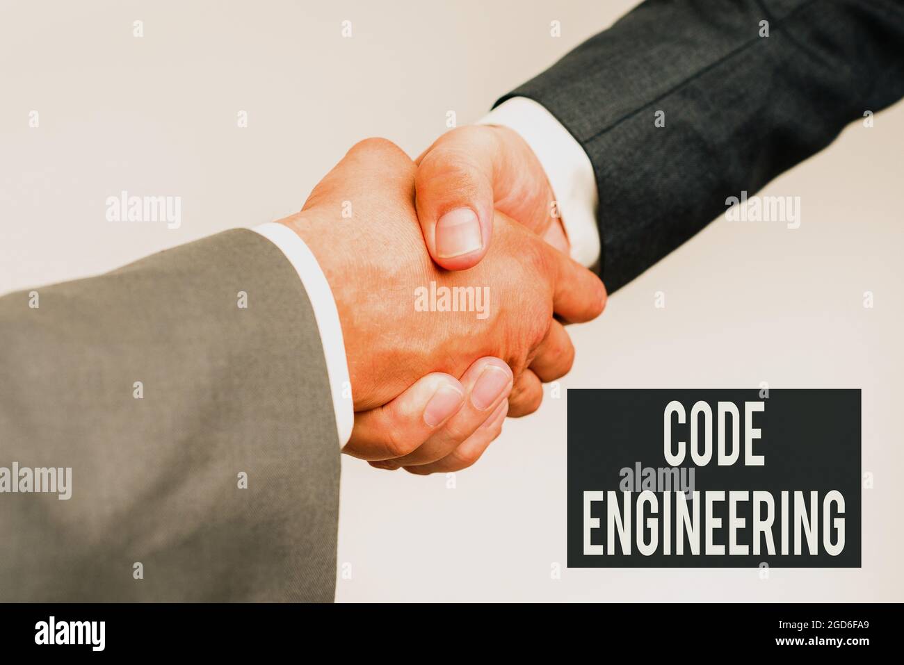 Writing displaying text Code Engineering. Business overview application of engineering to the development of software Two Professional Well-Dressed Stock Photo