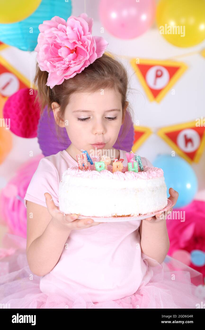 Pretty little girl with cake celebrate her birthday Stock Photo Alamy