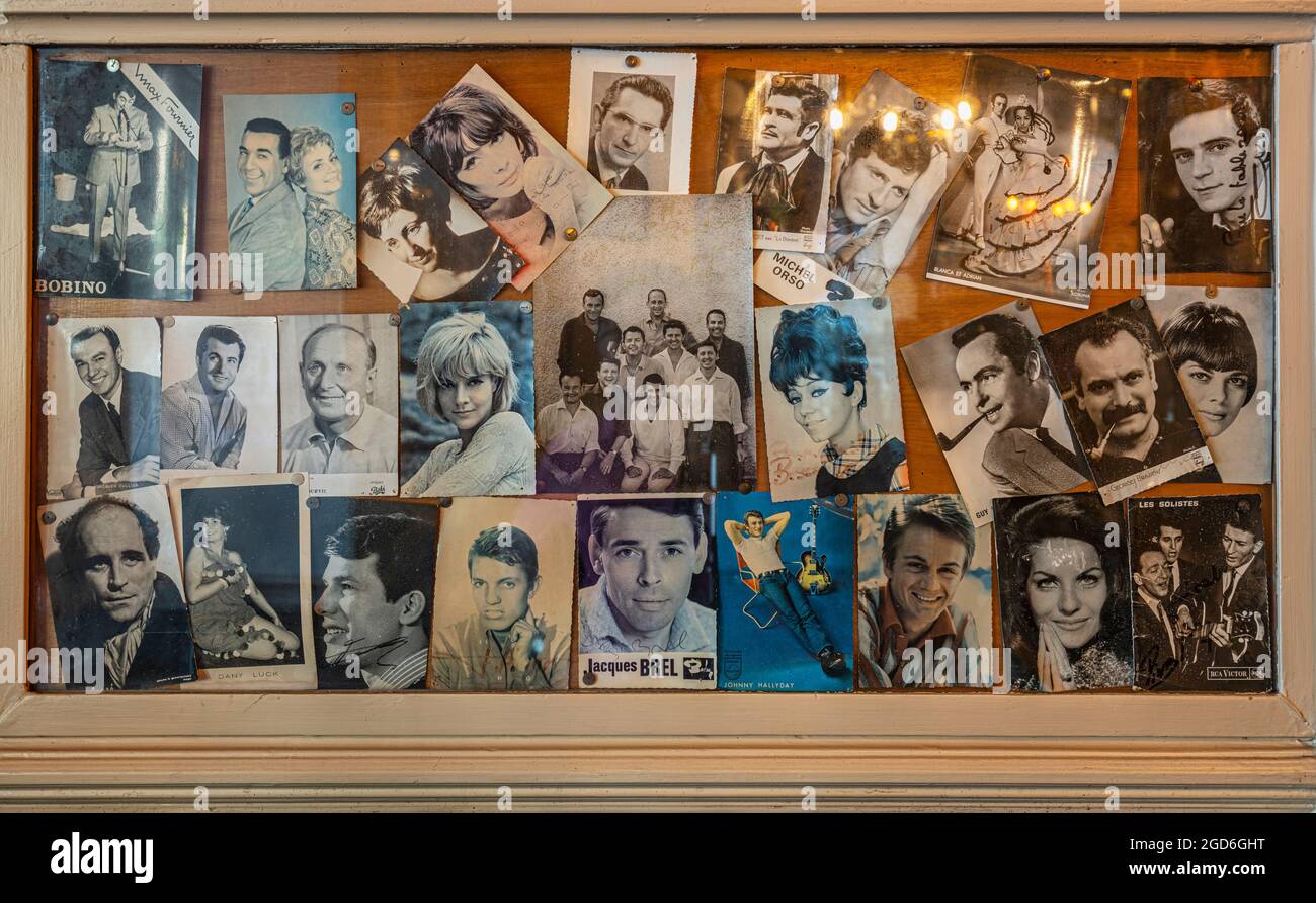 la table ronde is the artists café. A frame contains photos of famous actors and singers who have passed through the historic local . Grenoble, france Stock Photo