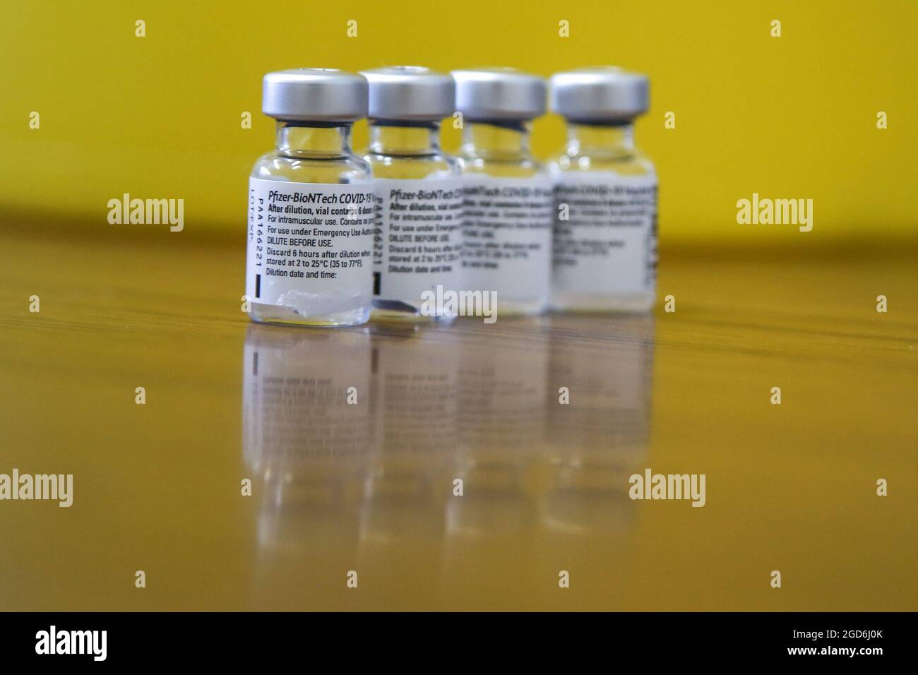 London, UK. 09th Aug, 2021. Reflection of vials containing Pfizer-BioNTech Covid-19 vaccine at a vaccination centre in London. Credit: SOPA Images Limited/Alamy Live News Stock Photo