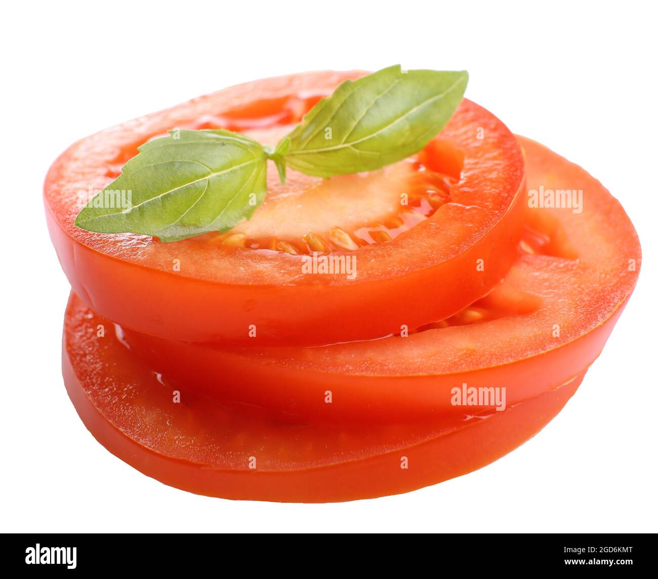 Slices of fresh tomato with basil, isolated on white Stock Photo - Alamy