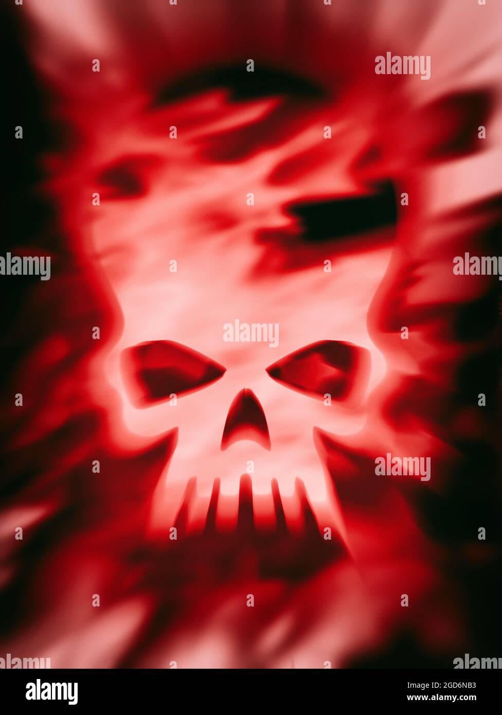 White distorted Pirate skull covered in flames in a red tone Stock