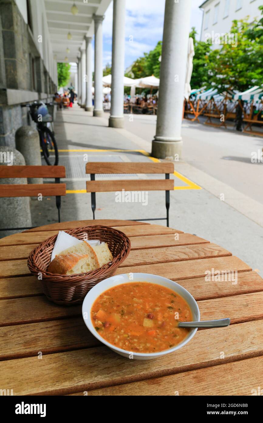 Ricet soup on wooden table - traditional Slovenian dish. Stock Photo