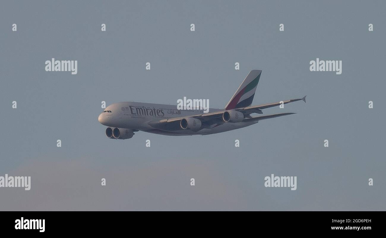 London, UK. 11 August 2021. Emirates A380 Airbus flight from Dubai on final approach to London Heathrow on a warm evening.  Heathrow passenger traffic rose 74% in July 2021 from the previous year but is still below July 2019 levels. Credit: Malcolm Park/Alamy Live News. Stock Photo