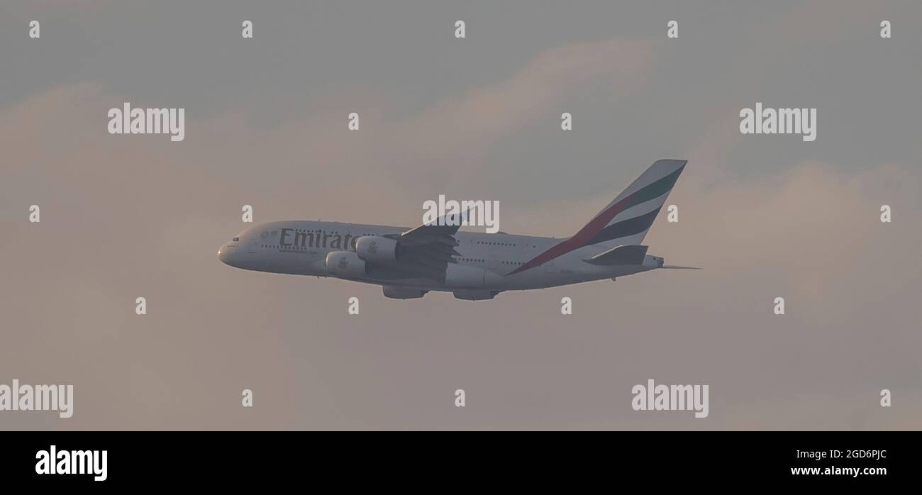 London, UK. 11 August 2021. Emirates A380 Airbus flight from Dubai on final approach to London Heathrow on a warm evening.  Heathrow passenger traffic rose 74% in July 2021 from the previous year but is still below July 2019 levels. Credit: Malcolm Park/Alamy Live News. Stock Photo