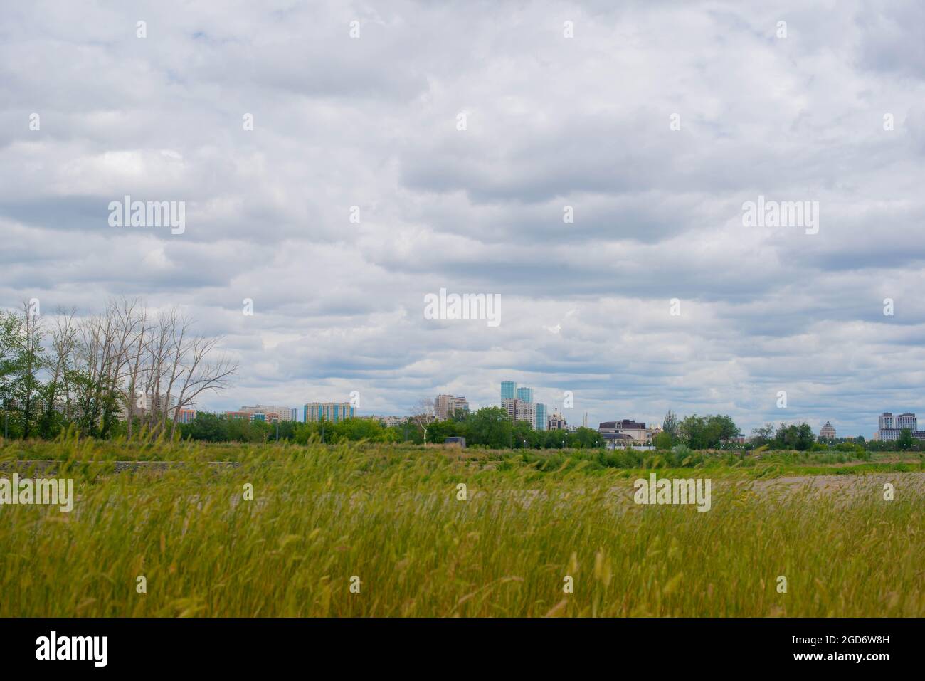 blue sky with clouds and green field Stock Photo - Alamy