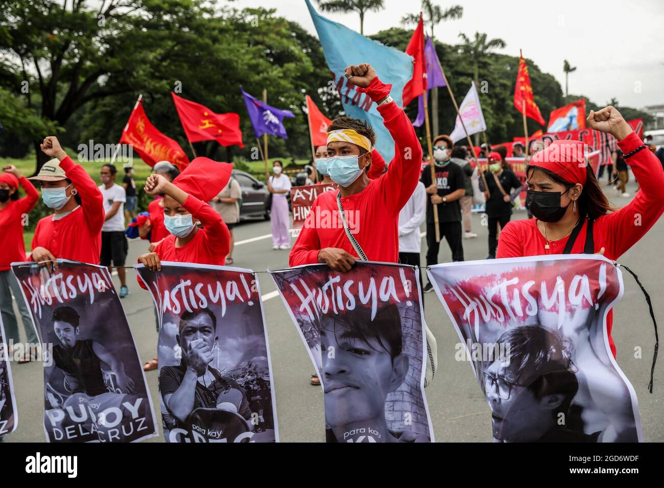 Protesters wearing protective gear with banners ahead of President Rodrigo Duterte's last state of the nation address in Quezon City, Metro Manila. Thousands of left-wing protesters gathered and marched toward the Philippine Congress where Duterte delivered his final state of the nation speech, winding down his six-year term amidst criticisms such as alleged human rights violations, mishandling of the coronavirus pandemic and inaction to confront China’s aggressive behavior in the disputed South China Sea. Philippines. Stock Photo