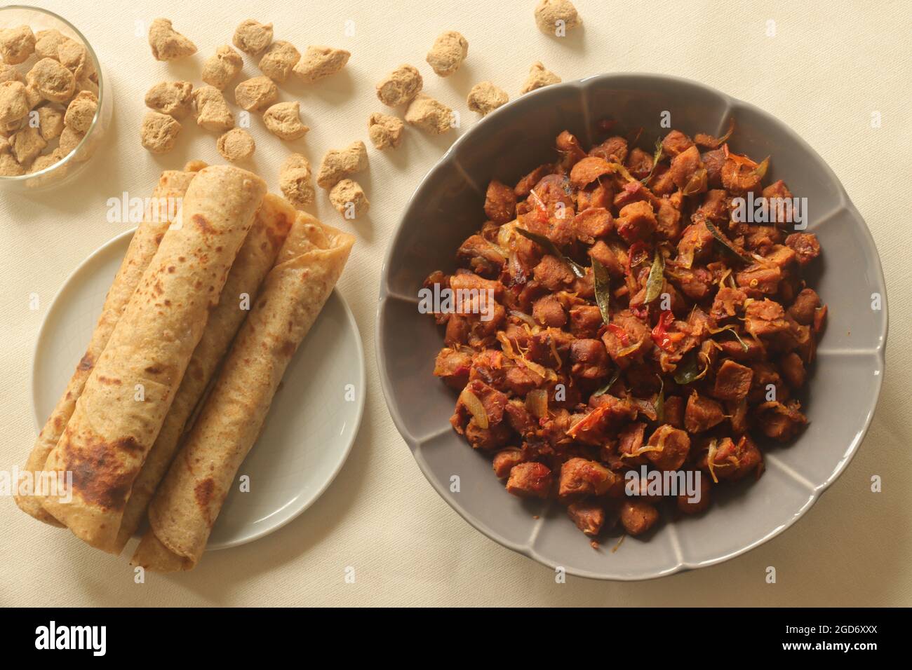 Dry roasted soya chunks with onions tomatoes and spices. Prepared with  Kerala style meat masala in coconut oil. Served with indian flatbread. Shot  on Stock Photo - Alamy