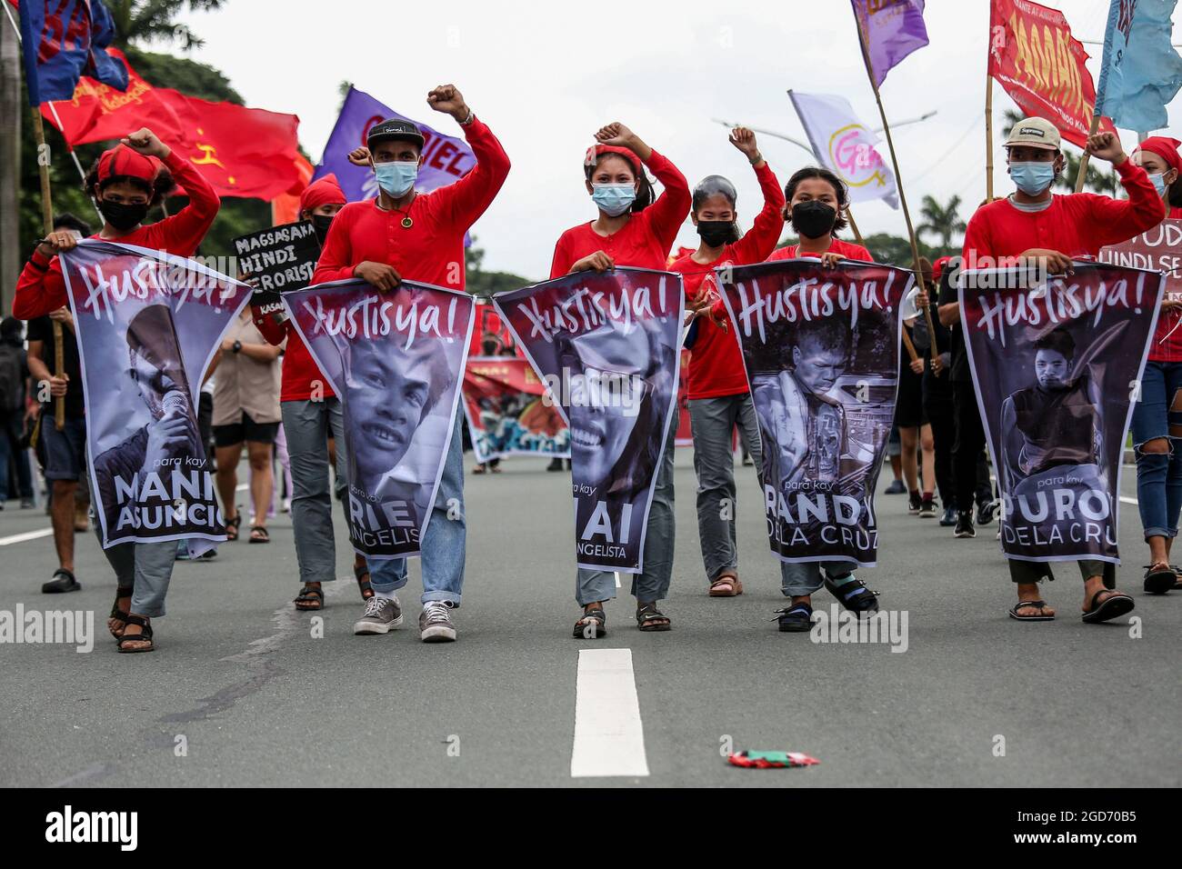 Protesters wearing protective mask with banners ahead of President Rodrigo Duterte's last state of the nation address in Quezon City, Metro Manila. Thousands of left-wing protesters gathered and marched toward the Philippine Congress where Duterte delivered his final state of the nation speech, winding down his six-year term amidst criticisms such as alleged human rights violations, mishandling of the coronavirus pandemic and inaction to confront China’s aggressive behavior in the disputed South China Sea. Philippines. Stock Photo
