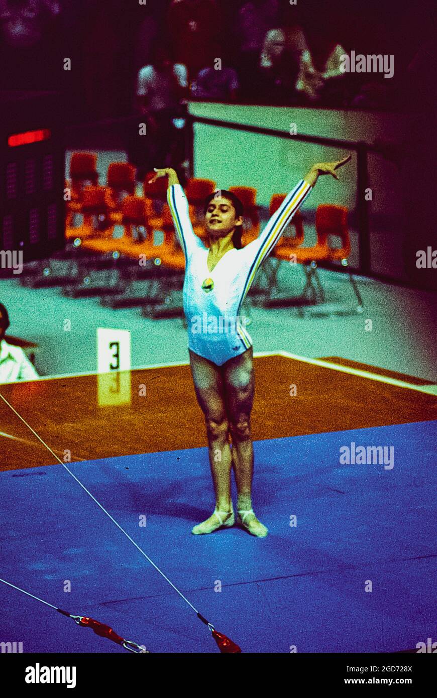 Nadia Comaneci (ROM) performs on the uneven bars at the 1976 Olympic Summer Games, Montreal, Canada Stock Photo