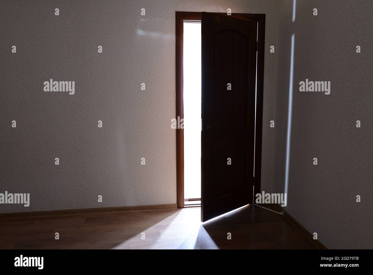 Open door with bright light outside Stock Photo - Alamy