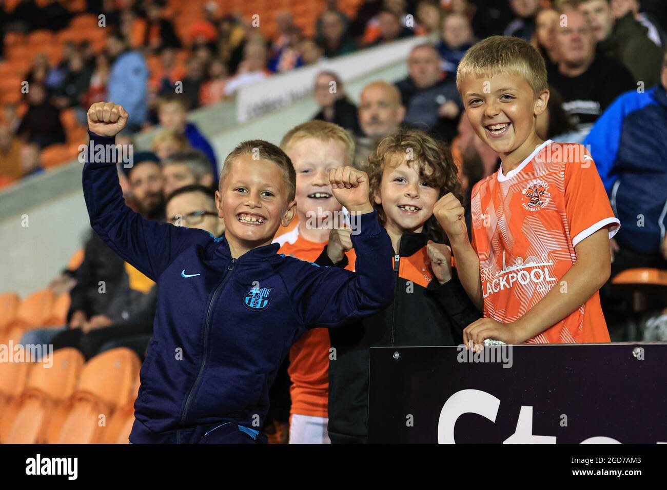 Four young Blackpool fans celebrate their 3-0 win Stock Photo - Alamy