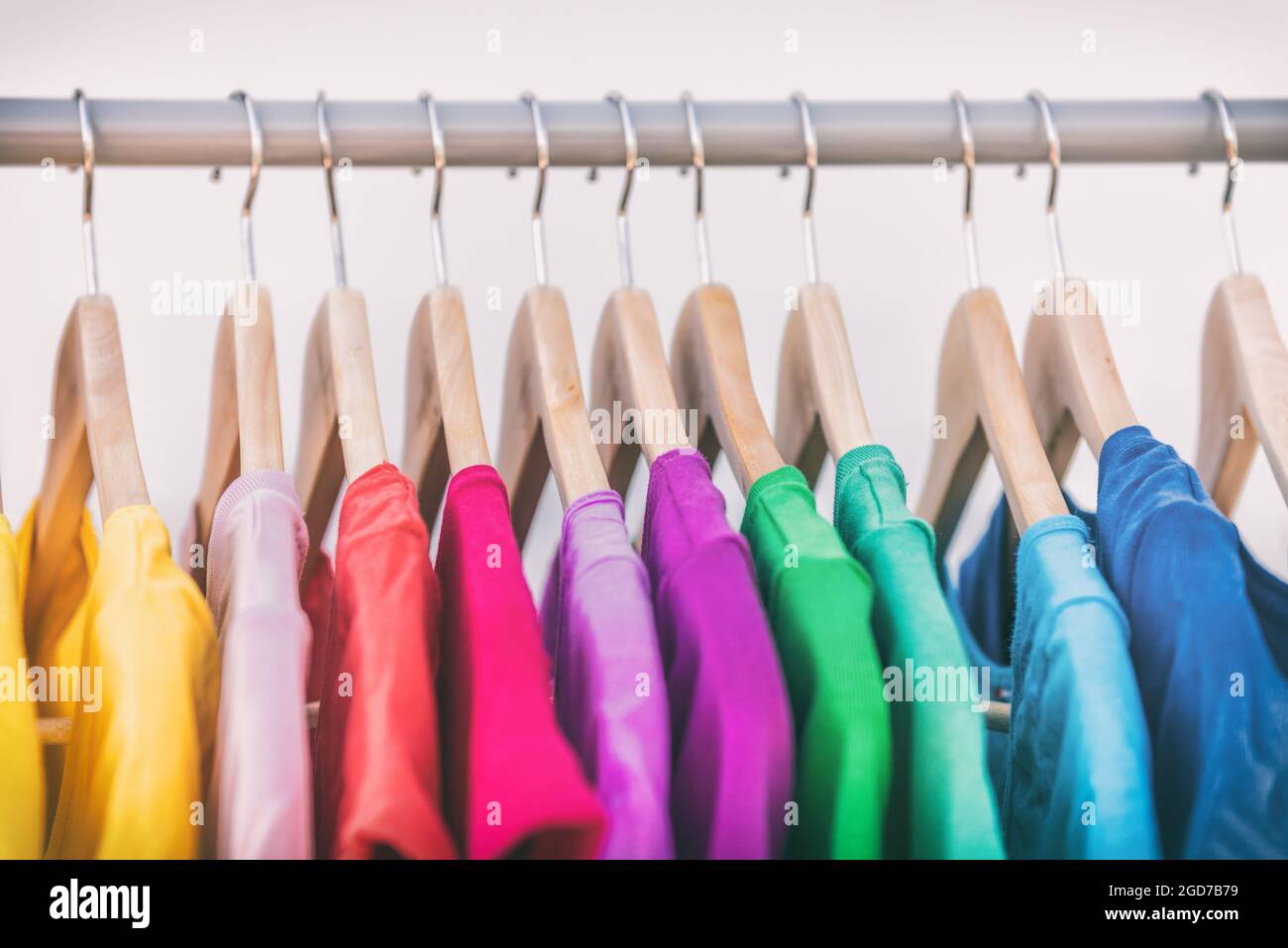 https://c8.alamy.com/comp/2GD7B79/clothes-hanging-on-clothing-rack-wardrobe-fashion-apparel-selection-of-rainbow-color-t-shirts-on-closet-hangers-womens-wear-in-store-shopping-spring-2GD7B79.jpg