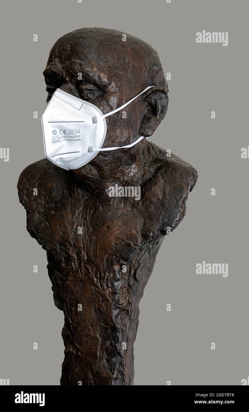 Bronze Sculpture With FFP 2 Mask Stock Photo