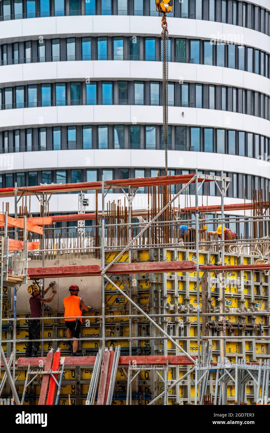 Construction site, construction of an office building, scaffolding, concrete worker, Düsseldorf, NRW, Germany, Stock Photo