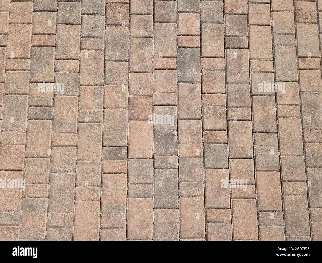 Top view of a beautiful brown stone pavement texture on a warm sunny ...