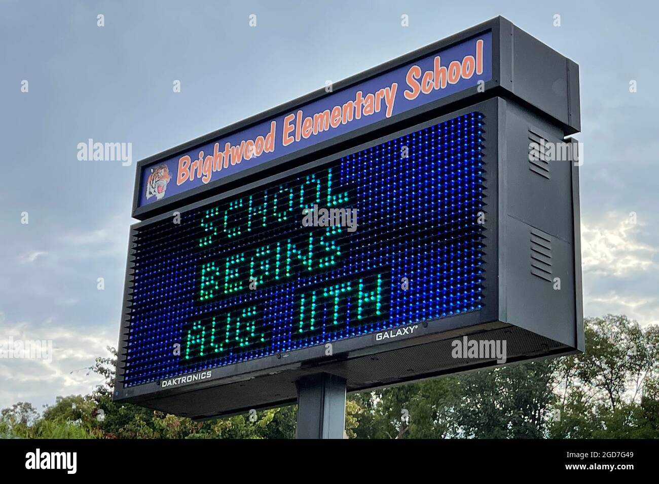 A School Begins Aug. 11 sign at Brightwood Elementary School, Wednesday, Aug. 11, 2021, in Monterey Park, Calif. Stock Photo