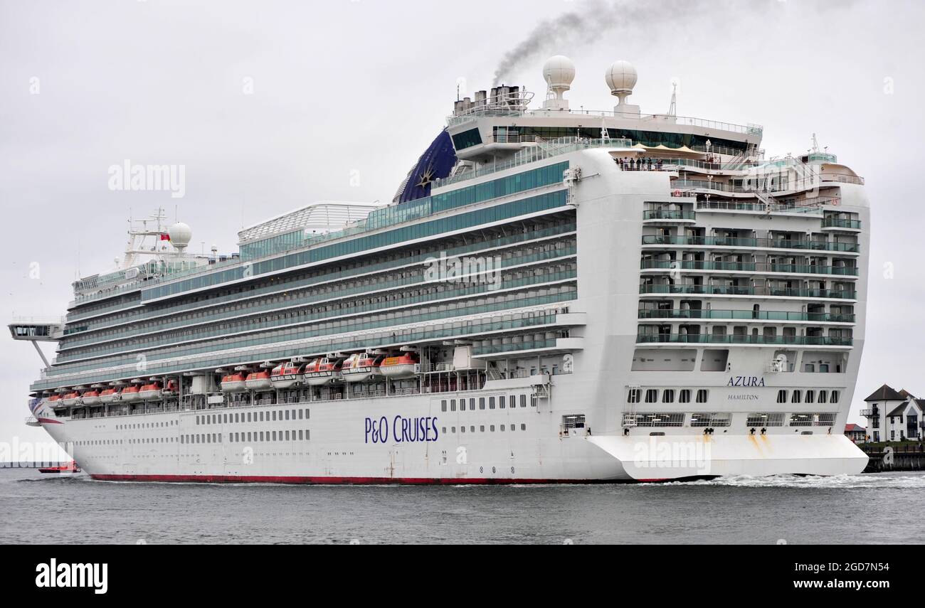 AJAXNETPHOTO. JULY, 2021. NORTH SHIELDS, ENGLAND. - OUTWARD BOUND- THE 115,055 GROSS TON CARNIVAL CRUISE LINE SHIP AZURA OPERATED BY P&O CRUISES OUTWARD BOUND FROM THE RIVER TYNE AFTER BEING LAID-UP ALONGSIDE THE INTERNATIONAL PASSENGER TERMINAL DURING THE COVID PANDEMIC. VESSEL WAS BUILT BY ITALIAN YARD FINCANTIERI AT MONFALCONE IN 2010.PHOTO:TONY HOLLAND/AJAX REF:DTH212707_38946 Stock Photo