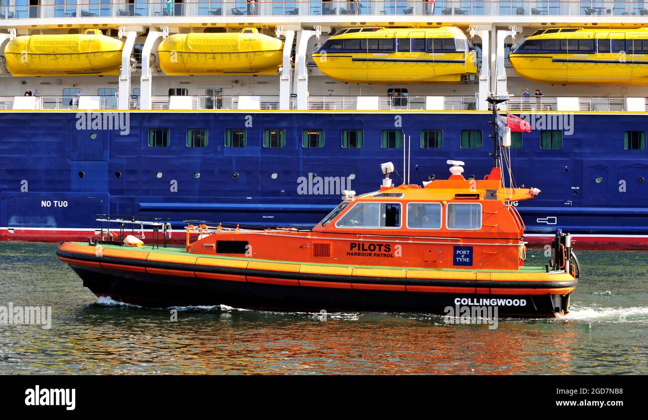 AJAXNETPHOTO. JULY, 2021. RIVER TYNE, ENGLAND. - WORKBOAT - HARBOUR PILOT BOAT COLLINGWOOD IN COMPANY WITH OUTWARD BOUND CRUISE SHIP. PHOTO:TONY HOLLAND/AJAX REF:DTH212707 39047 Stock Photo