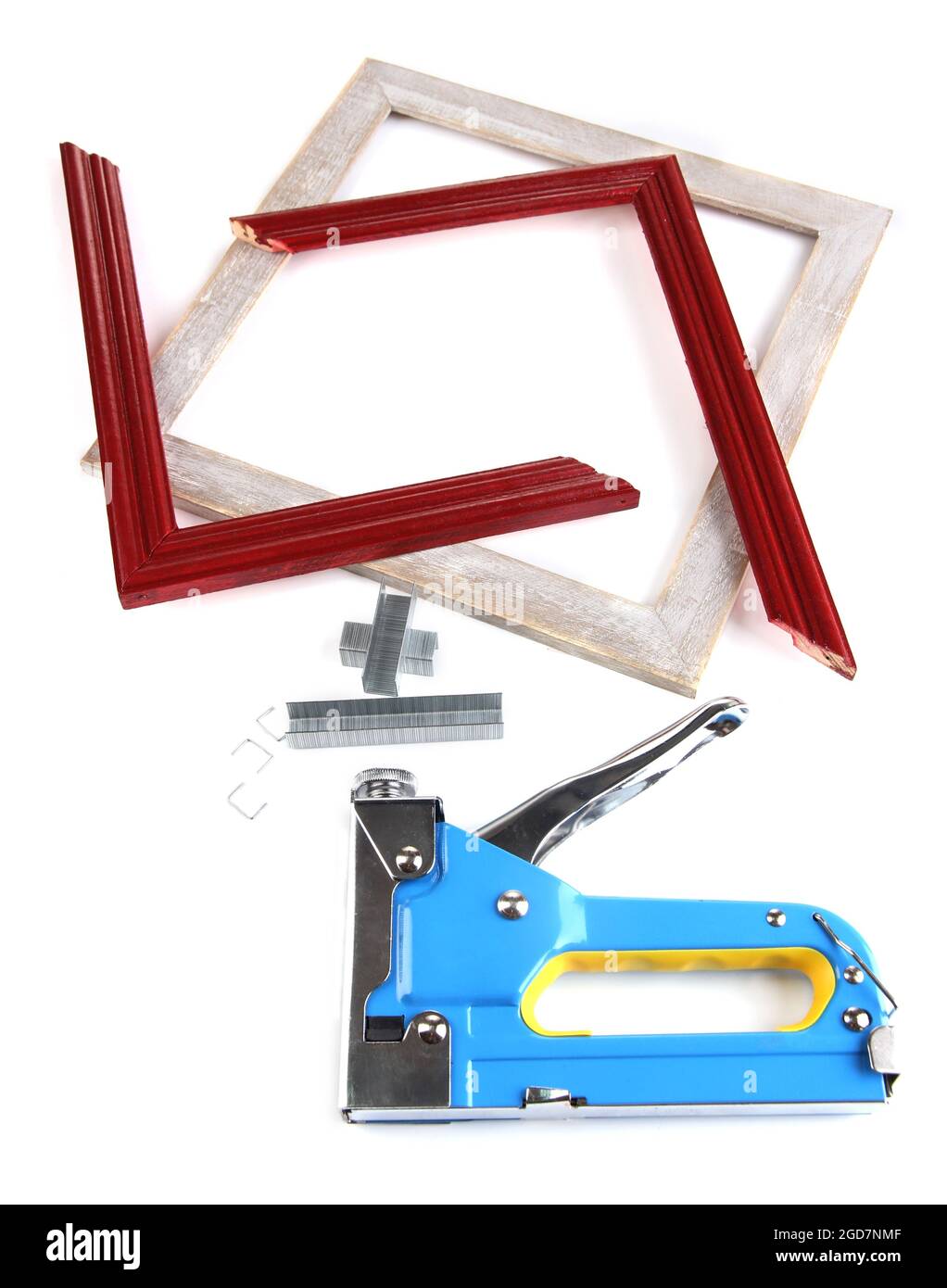 Construction stapler and wooden frames isolated on white Stock Photo