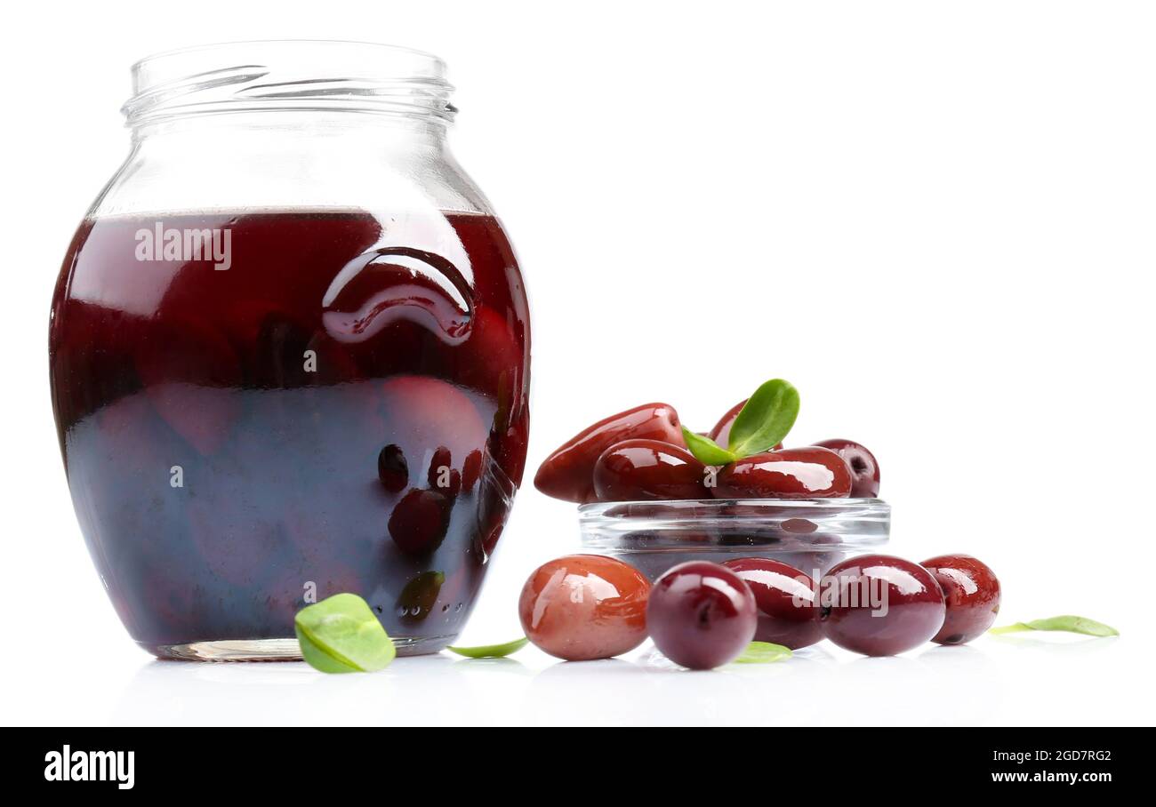 Black olives in glass jar, isolated on white Stock Photo Alamy