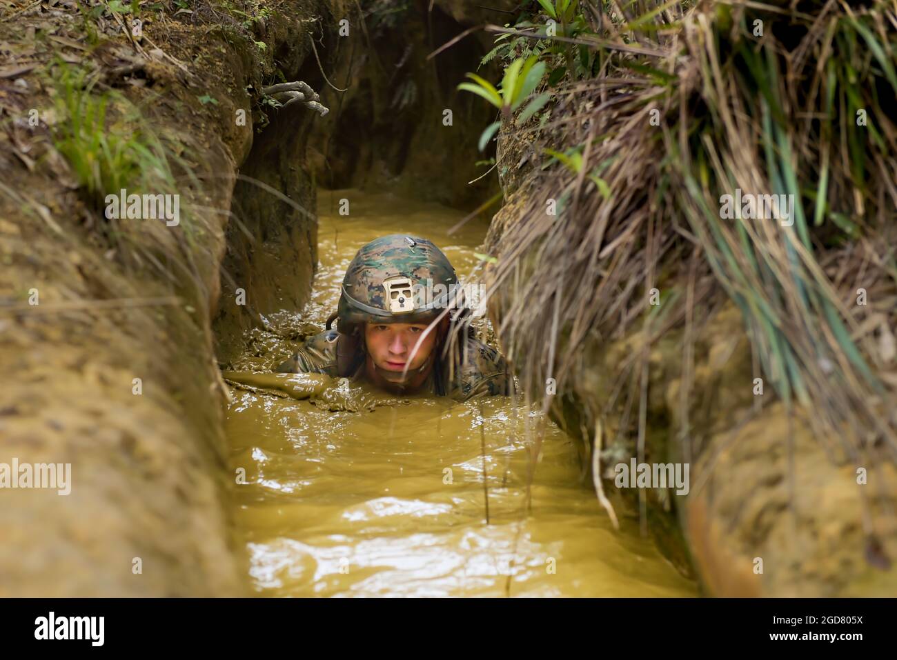 OKINAWA, Japan (Apr. 15, 2021) Seabees with Naval Mobile Construction Battalion (NMCB) 4 and Marines with 9th Engineer Support Battalion maneuver through a course at the Jungle Warfare Training Center. NMCB-4, based out of Port Hueneme, California, is forward-deployed throughout the Indo-Pacific region ready to deliver engineering solutions and construction of expeditionary and advanced naval base facilities to Naval and Joint Force Commanders. (U.S. Navy photo by Mass Communication Specialist 2nd Class Douglas Parker) Stock Photo