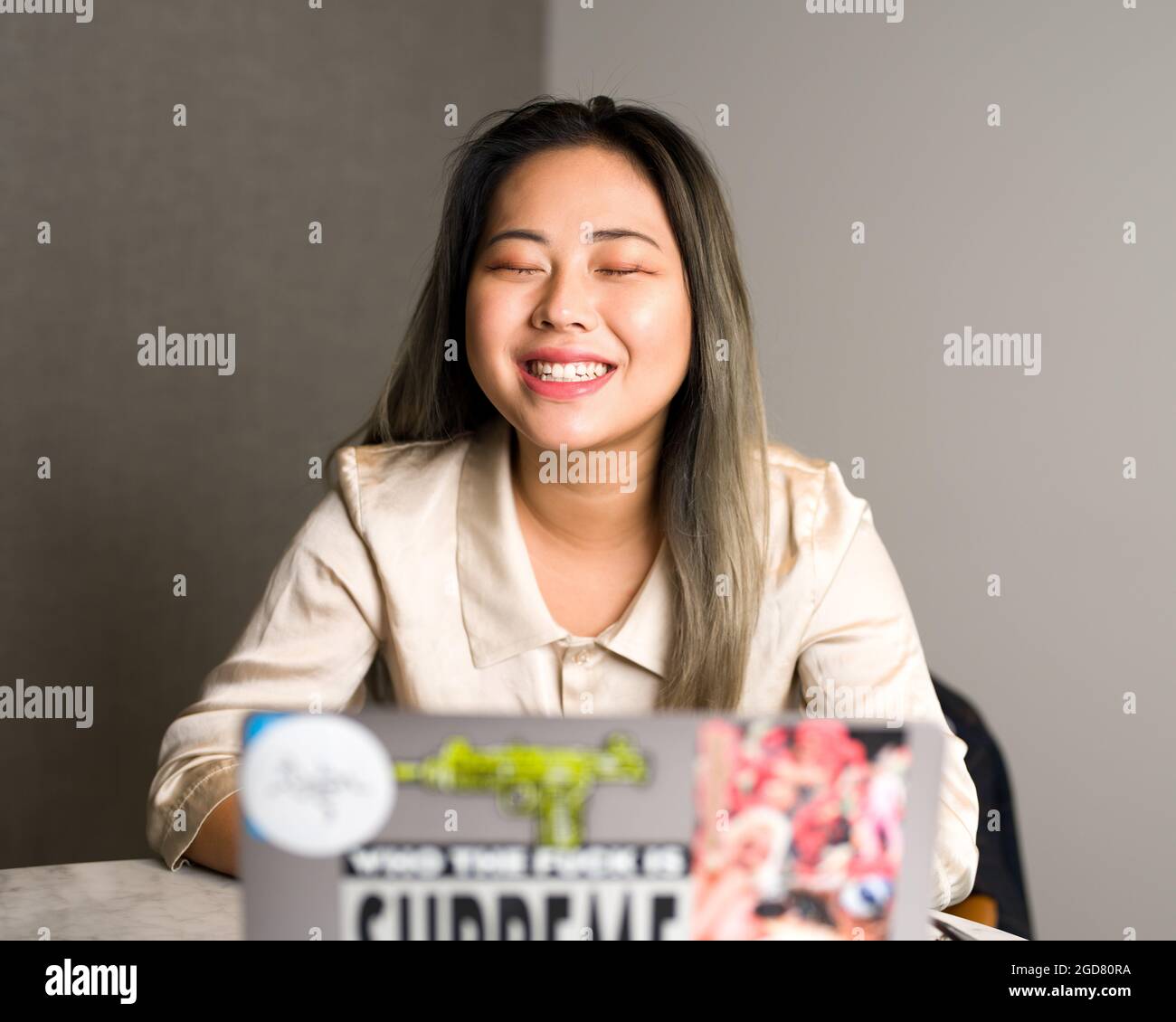 Young Asian Female Data Scientist Enjoying a Work Meeting Stock Photo