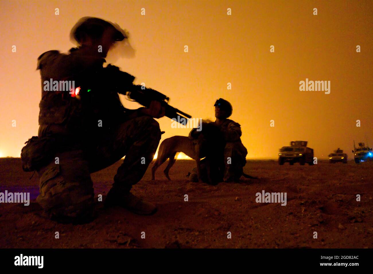 U.S. Air Force defenders with the 378th Expeditionary Security Forces Squadron act as members of a dismounted patrol during a quick response training event in blackout conditions at Prince Sultan Air Base, Kingdom of Saudi Arabia, June 12, 2021. PSAB Explosive Ordnance Disposal, Security Forces and Medical personnel participated in integrated training to bolster defensive capabilities and maintain readiness at all times. (U.S. Air Force Photo by Senior Airman Samuel Earick) Stock Photo