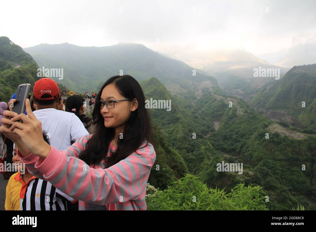 KEDIRI, INDONESIA - March 25, 2016: Tourists enjoying the scenery at the Mount Kelud tourist site Stock Photo