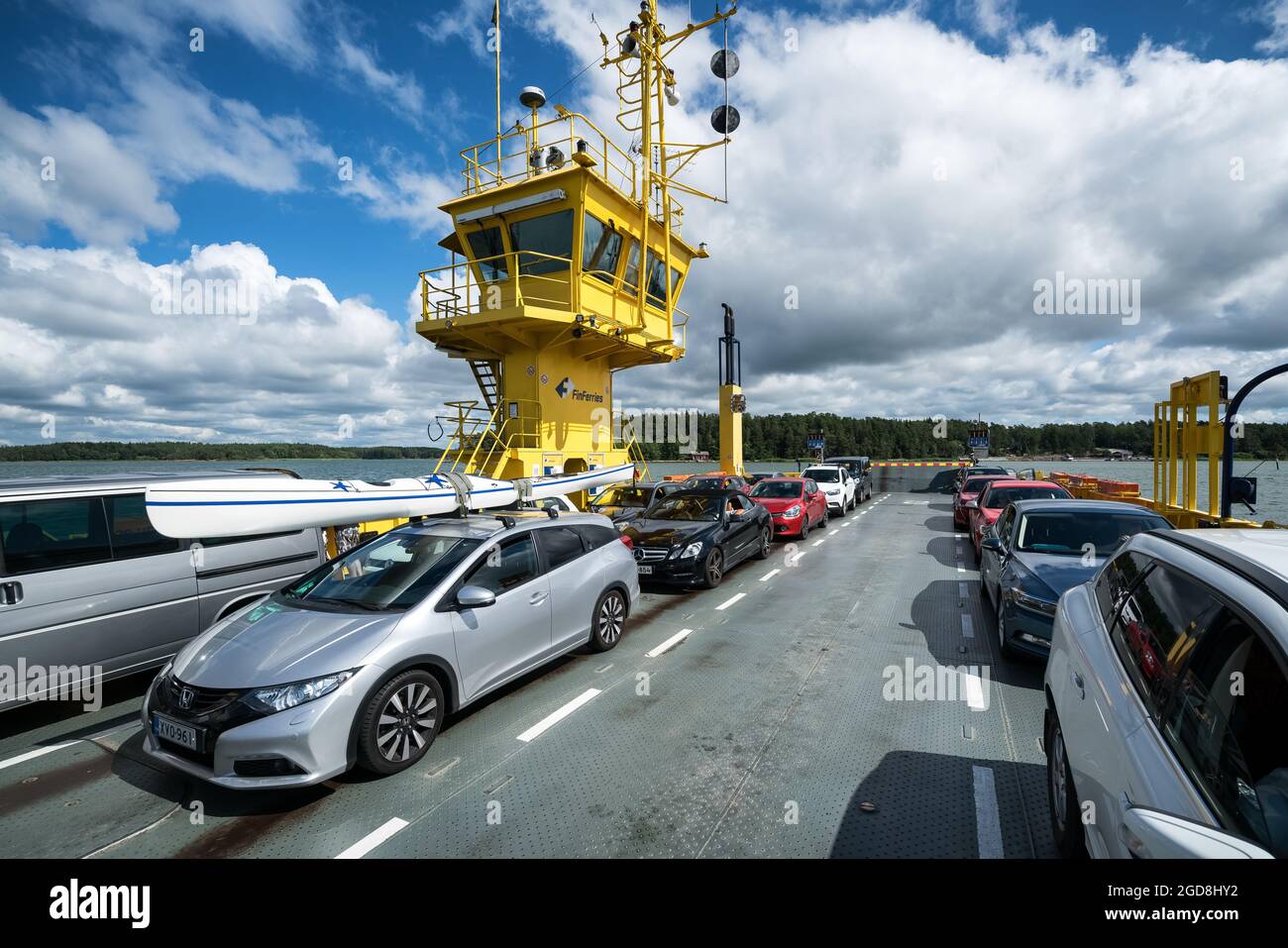 Transporting a kayak on top of a car and taking a ferry in the Kustavi