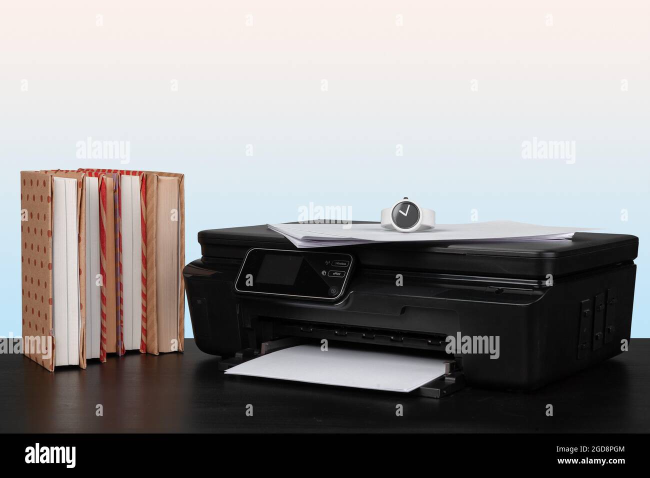 Compact home laser printer against gray background Stock Photo