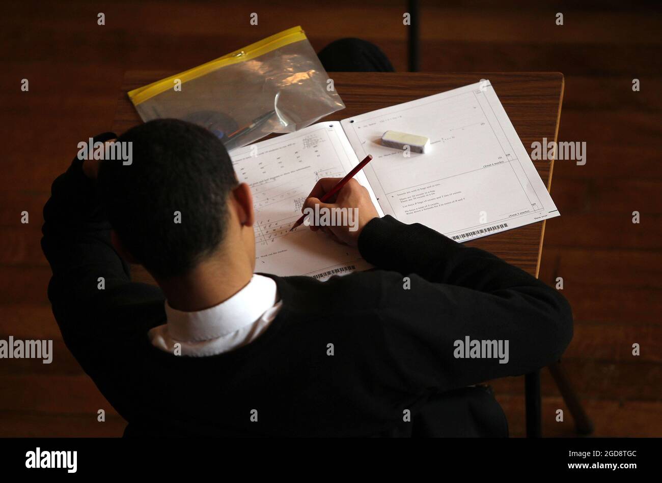 File photo dated 02/03/12 of a maths exam in progress. Thousands of students across Northern Ireland will receive their teacher-assessed GCSE grades later. It comes after formal examinations were cancelled for the second year in a row due to the coronavirus pandemic. Issue date: Thursday August 12, 2021. Stock Photo