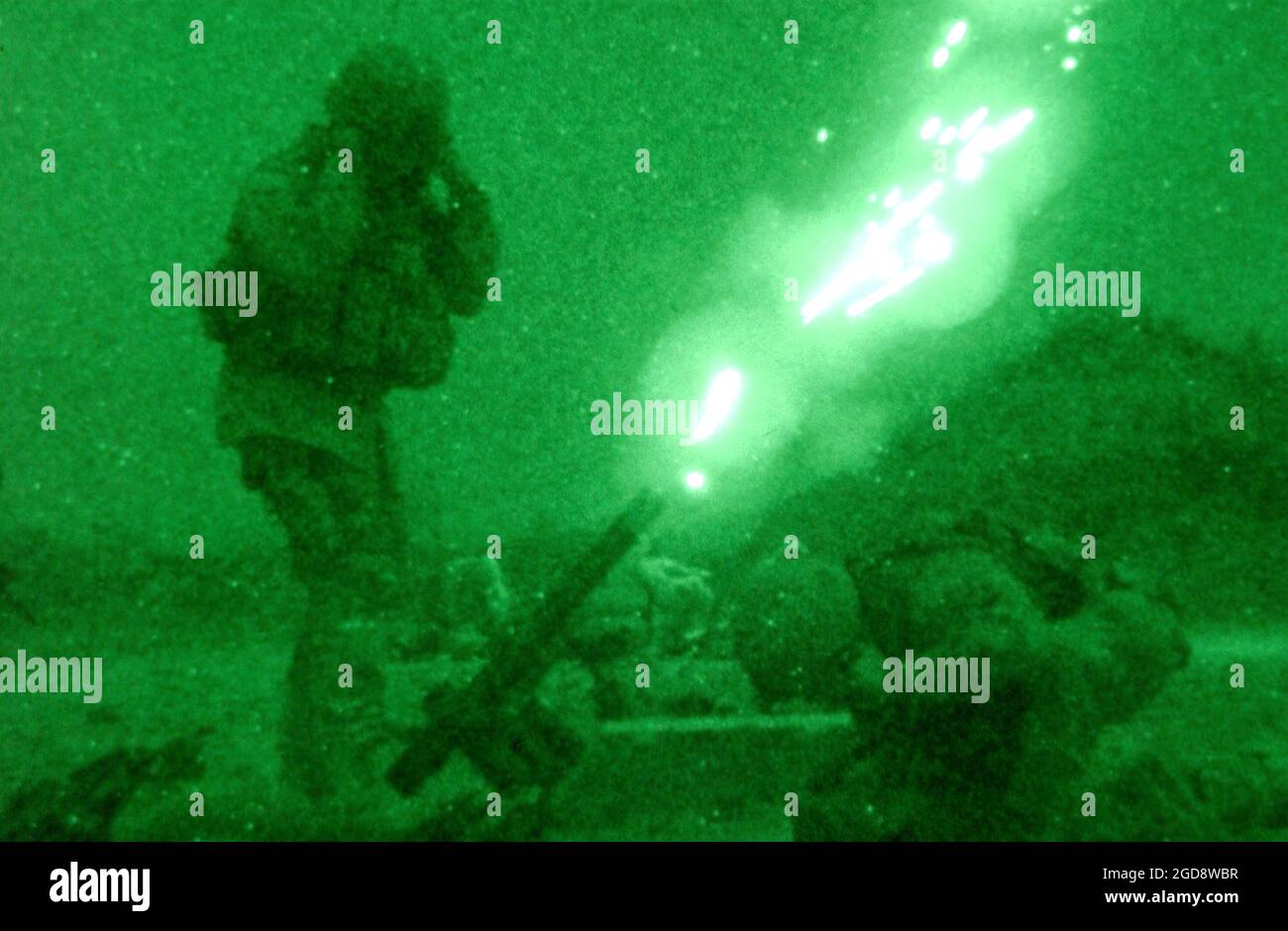 US Army (USA) Soldiers assigned to Alpha Company, 82nd Airborne Division, fire an M83A3 illumination round from their 60mm M224 lightweight company mortar, in order to get a better look at the outer perimeter of Bagram Air Base (AB), Afghanistan, during Operation ENDURING FREEDOM.  (USAF PHOTO BY SSGT CHERIE A. THURLBY 030116-F-7203T-006) Stock Photo