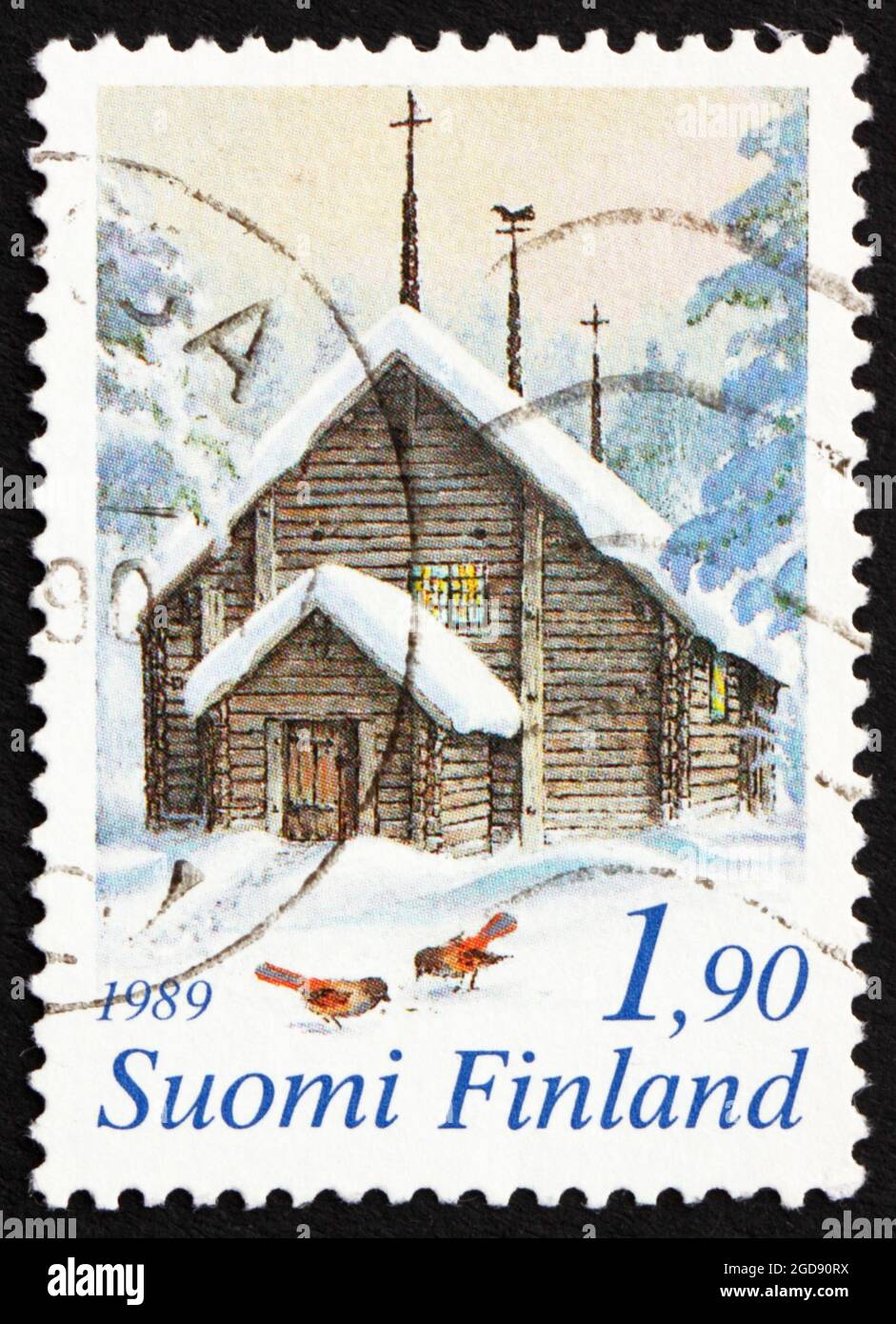 FINLAND - CIRCA 1989: a stamp printed in the Finland shows Sodankyla Church and Siberian Jays in Snow, Finland, Christmas, circa 1989 Stock Photo