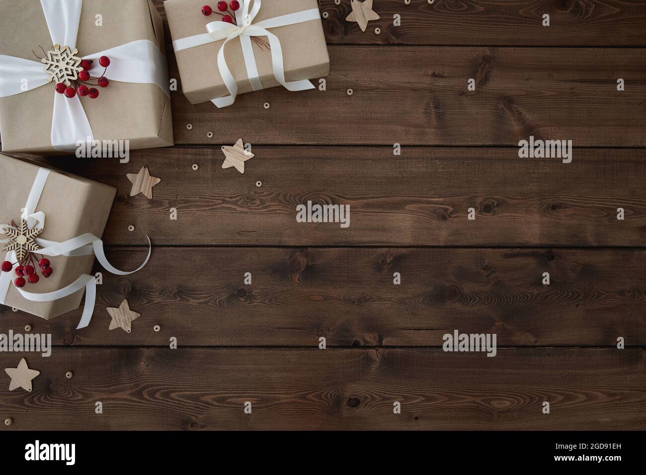 Christmas Background With Border Of Gift Boxes On Dark Brown Wood 