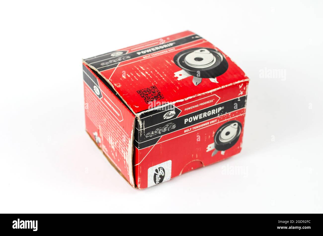 Timing belt tensioner to the red cardboard box on a white background
