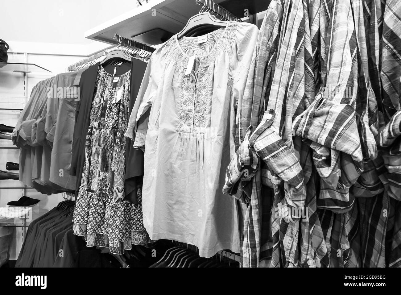 JOHANNESBURG, SOUTH AFRICA - Jan 06, 2021: A grayscale of apparel in Up-Market retail store in Johannesburg, South Africa Stock Photo