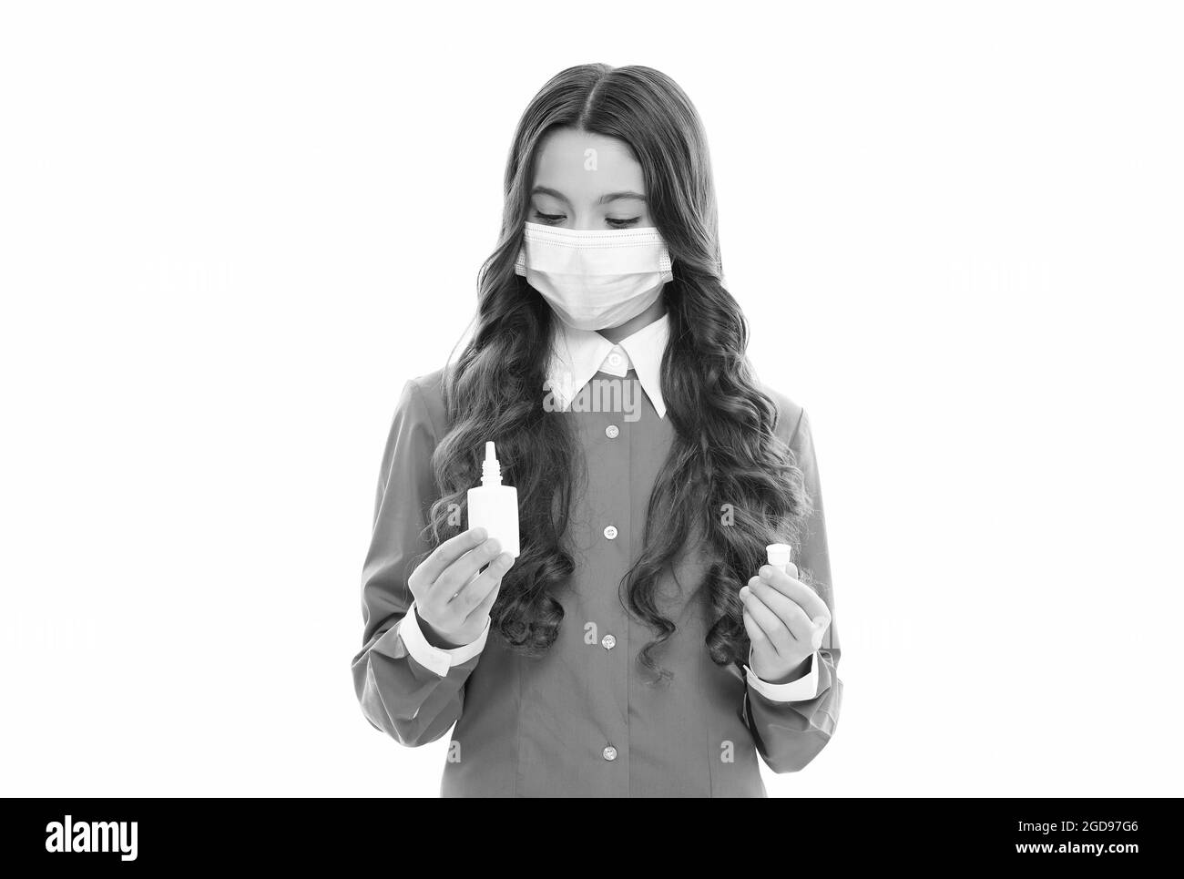 first symptoms of virus. kid treat runny nose with nasal spray. free