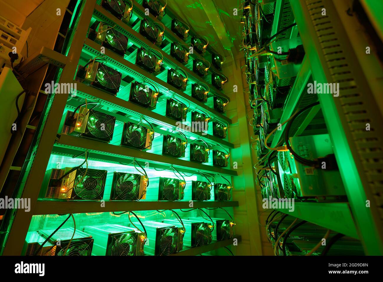 Bitcoin miners in large farm. ASIC mining equipment on stand racks mine  cryptocurrency in steel container. Blockchain techology application  specific Stock Photo - Alamy
