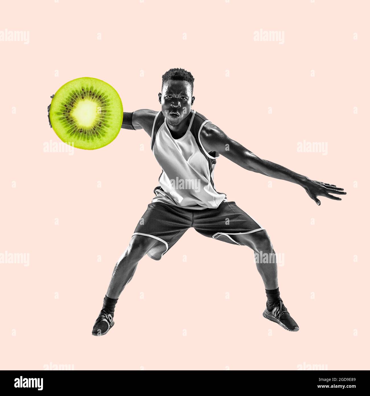 Fit young man with good food on color background. Male basketball