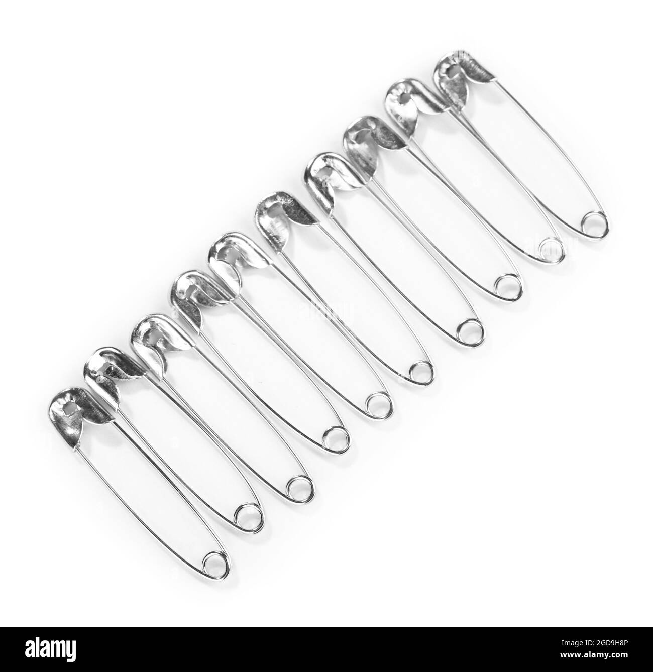 Safety pins isolated on white Stock Photo Alamy