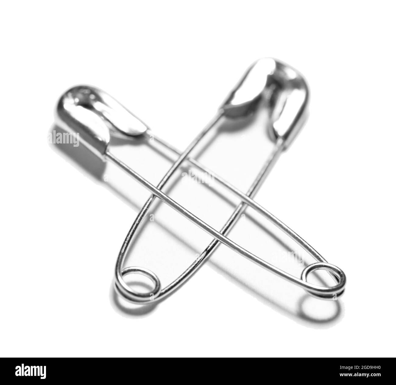 Safety pins isolated on white Stock Photo Alamy