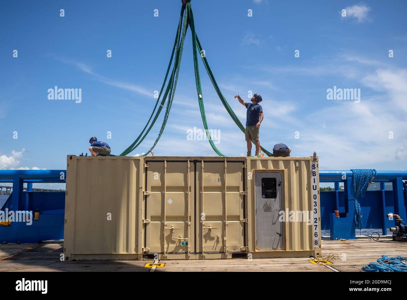 Sailors, assigned to Mobile Diving Salvage Unit (MDSU) 2, load a transportable recompression chamber system (TRCS) onto Ultra-Light Intervention vessel MV Connor Bordelon during Large-Scale Exercise (LSE 2021). LSE 2021 demonstrates the Navy’s ability to employ precise, lethal, and overwhelming force globally across three naval component commands, five numbered fleets, and 17 time zones. LSE 2021 merges live and synthetic training capabilities to create an intense, robust training environment. It will connect high-fidelity training and real-world operations, to build knowledge and skills neede Stock Photo