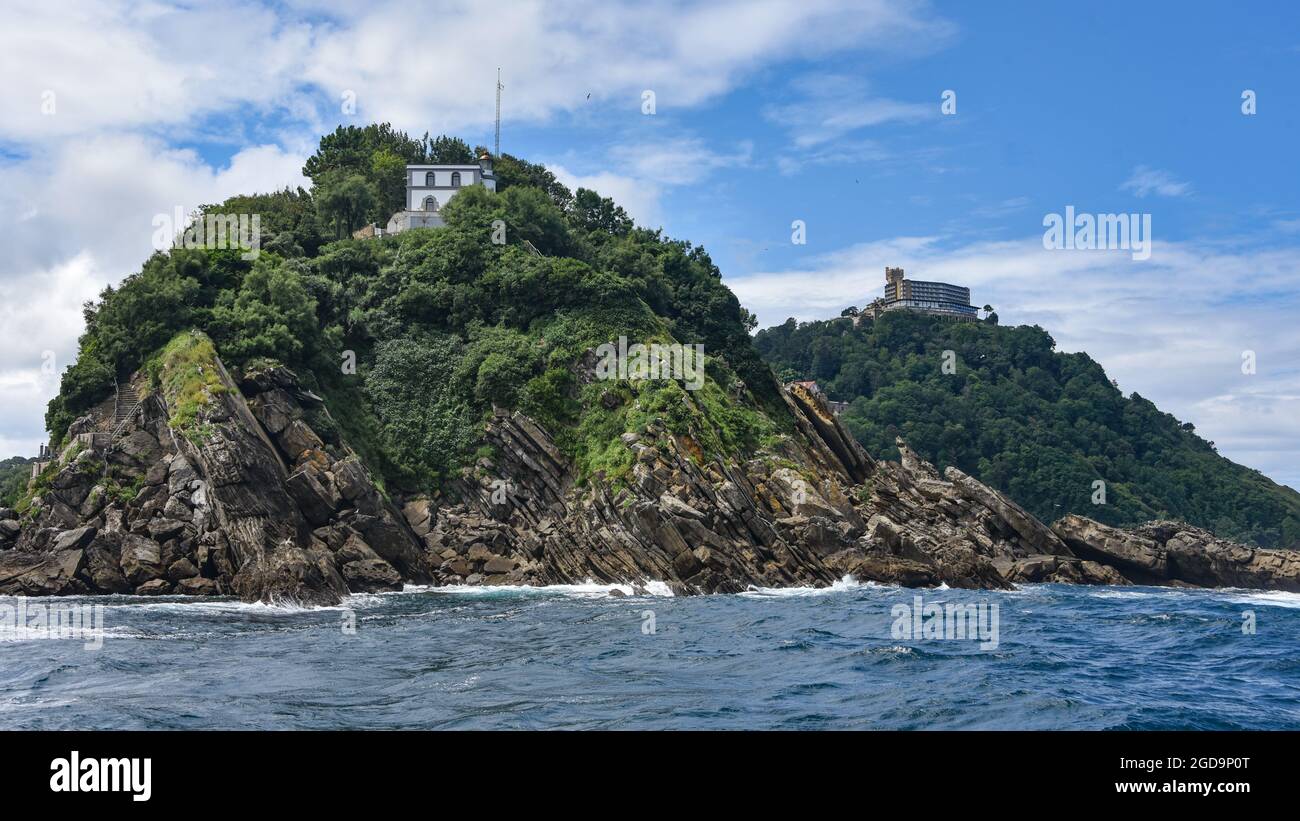 San Sebastian, Spain - 2 August 2021: Views of Monte Igueldo from Isla Santa Clara and La Concha Bay Stock Photo