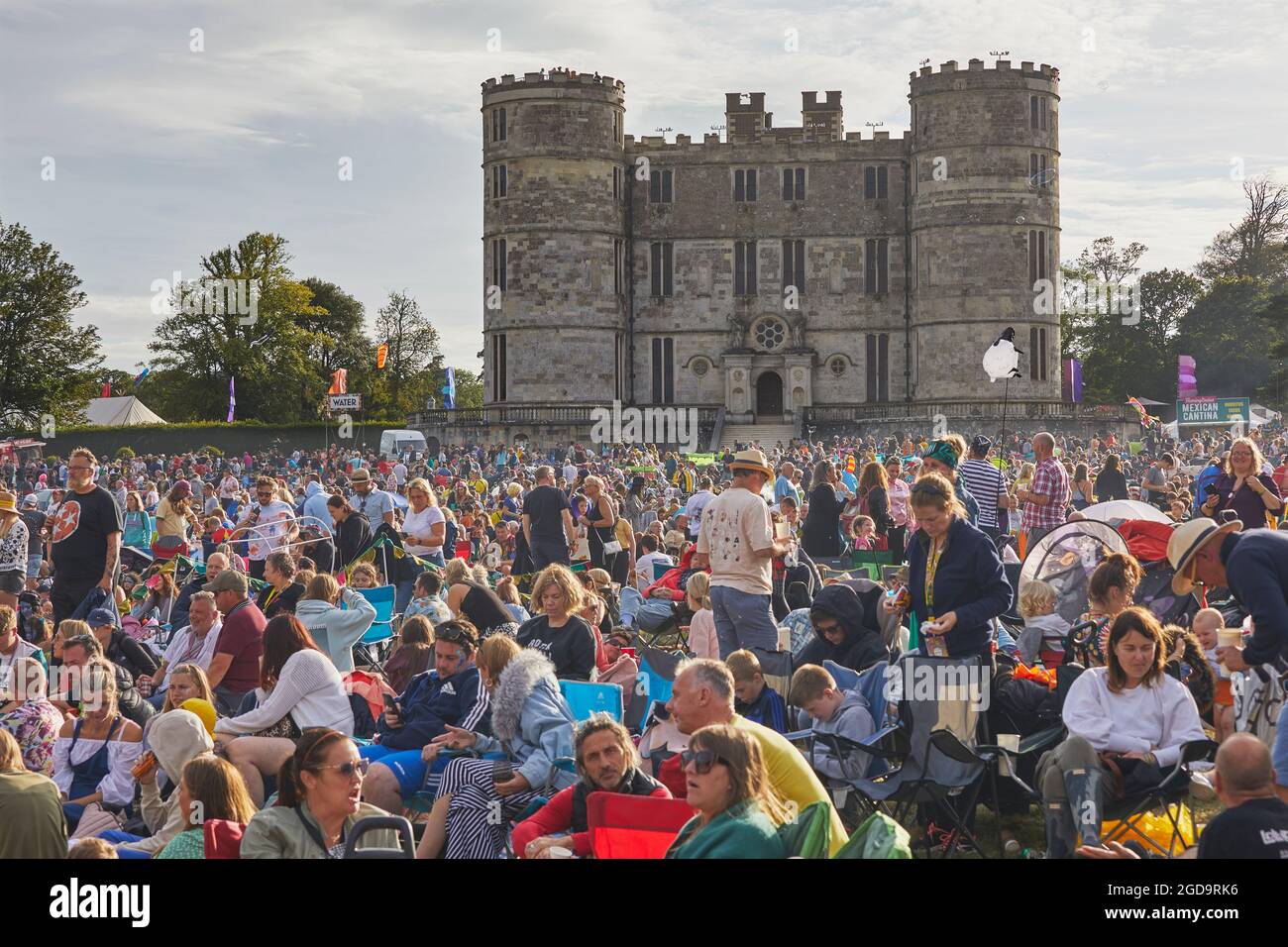 Crowds at a rock music festival, in front of Lulworth Castle. Camp Bestival, Lulworth, Dorset, Great Britain. Stock Photo
